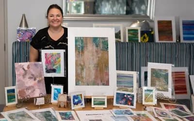 Woman smiling with artwork