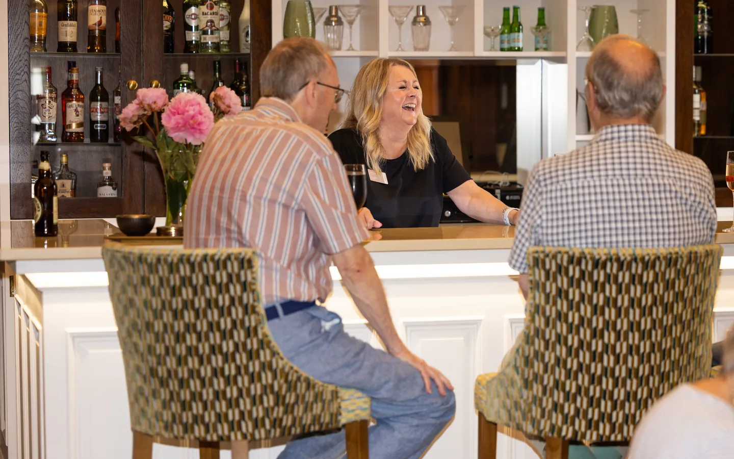 People drinking at the bar at Mount Battenhall