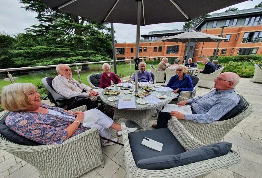 Residents sat around the table eating