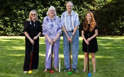 People playing croquet