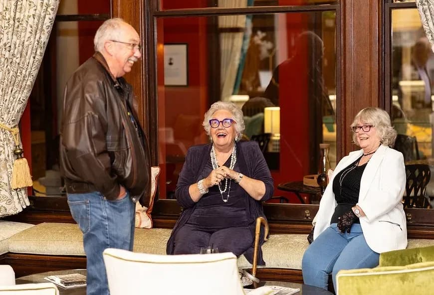 Homeowners laughing together at Mount Battenhall