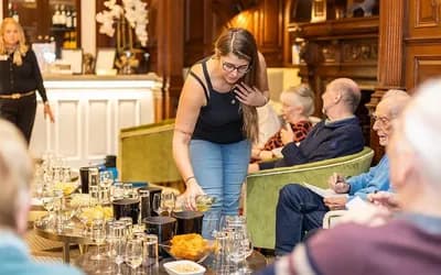 A woman pouring wine