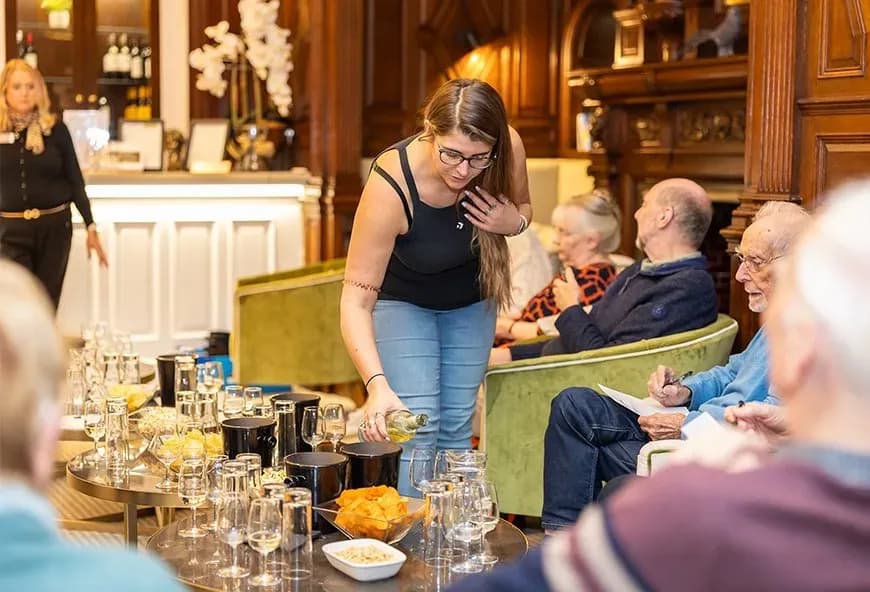 A woman pouring wine
