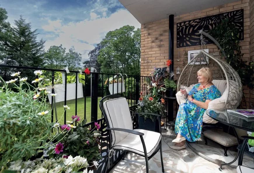 Women sat outside with a book