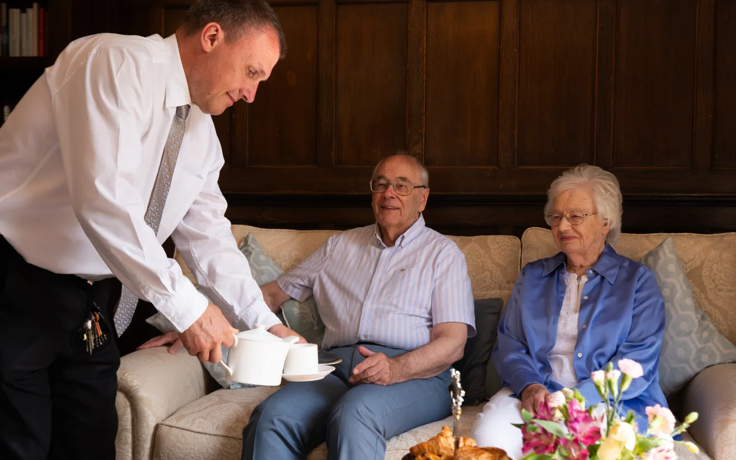Boughton Hall staff serving residents tea