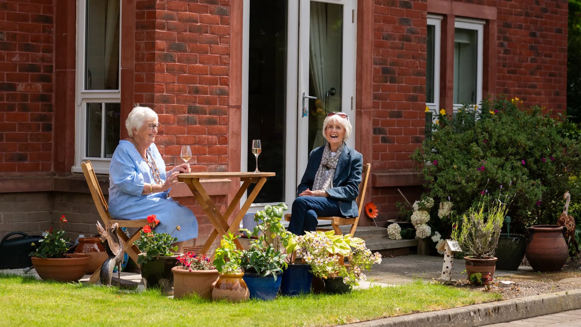 Boughton Hall residents sitting in the garden