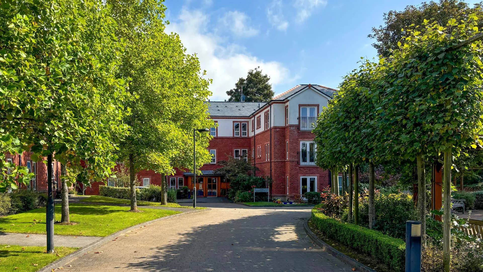 Boughton Hall village with treelined road