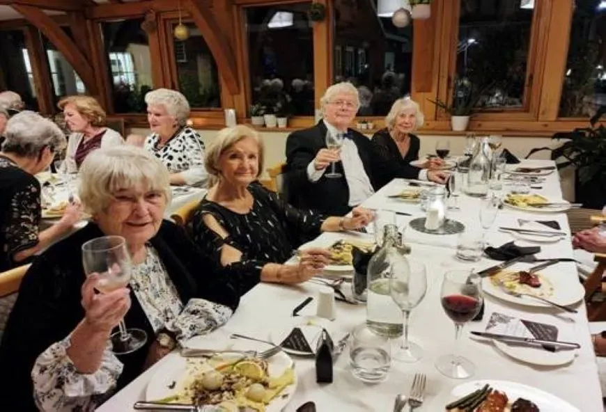 Boughton Hall residents dining at a black-tie event