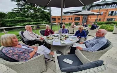 Residents sat around the table eating