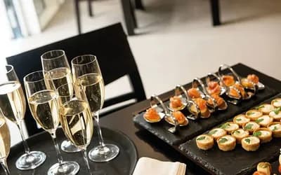 Two trays with prosecco and canapes