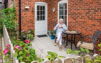 Women sat having a tea outside