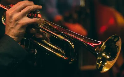 Someone playing a brass instrument