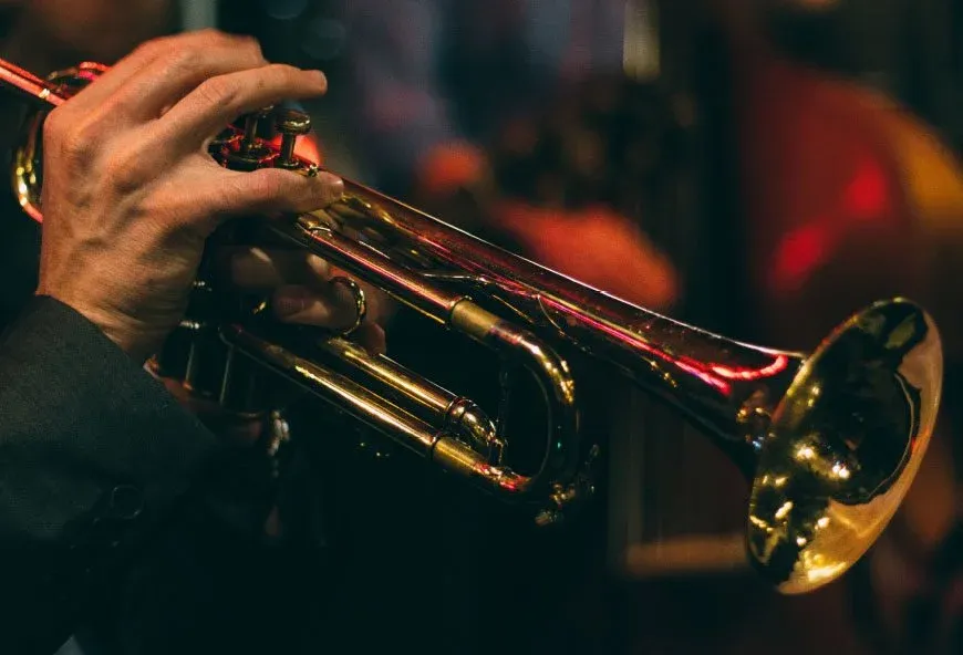 Someone playing a brass instrument