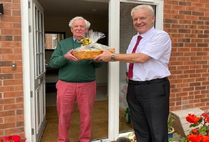 Kevan and James holding a hamper