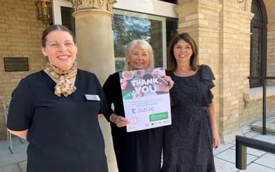 Women holding a Macmillan certificate