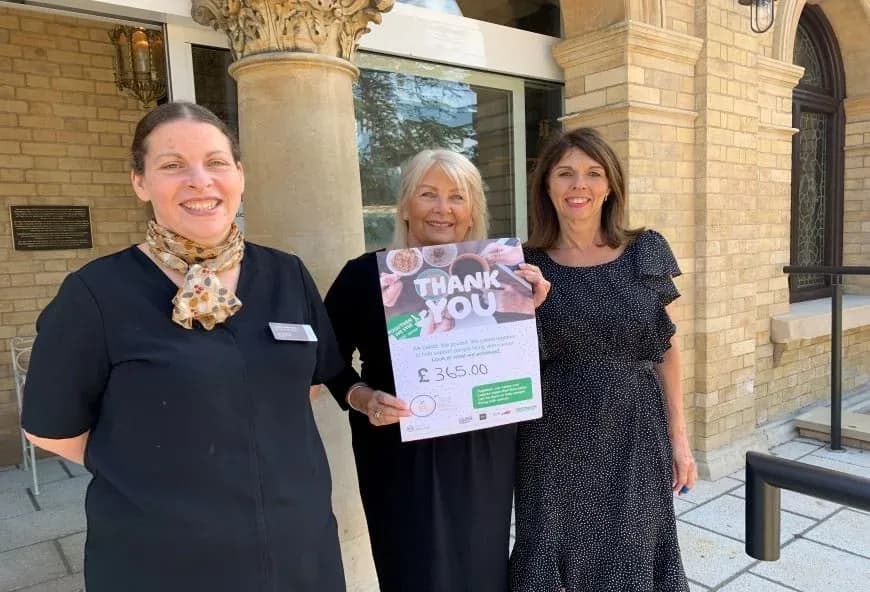 Women holding a Macmillan certificate