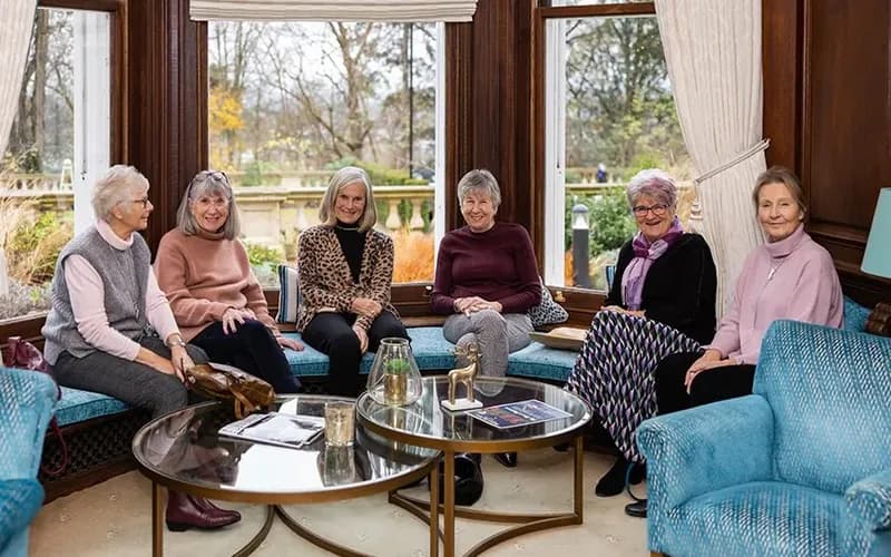 A group of women smiling together