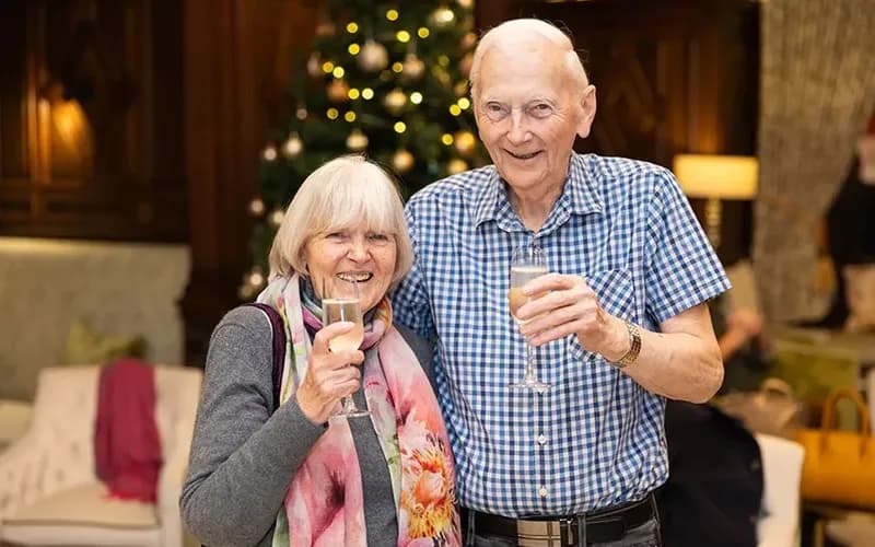 A couple with glasses of prosecco