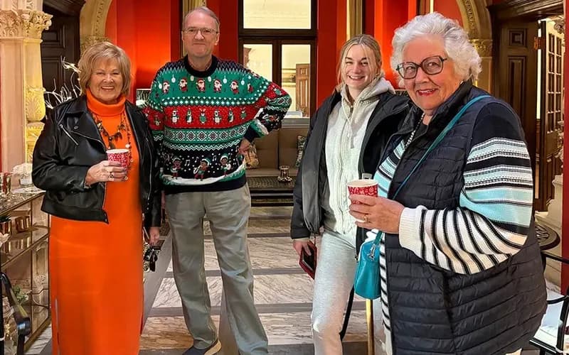 People smiling with hot drinks