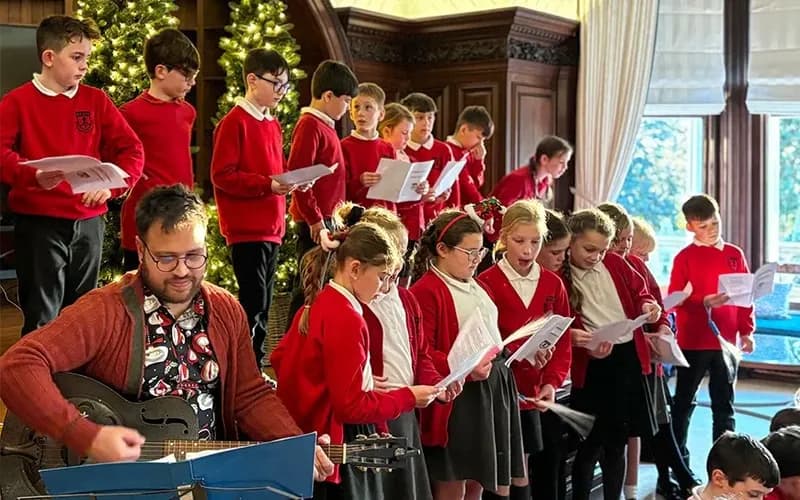 Children and teacher singing
