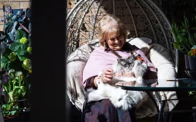 Mount Battenhall resident sat outside with her cat