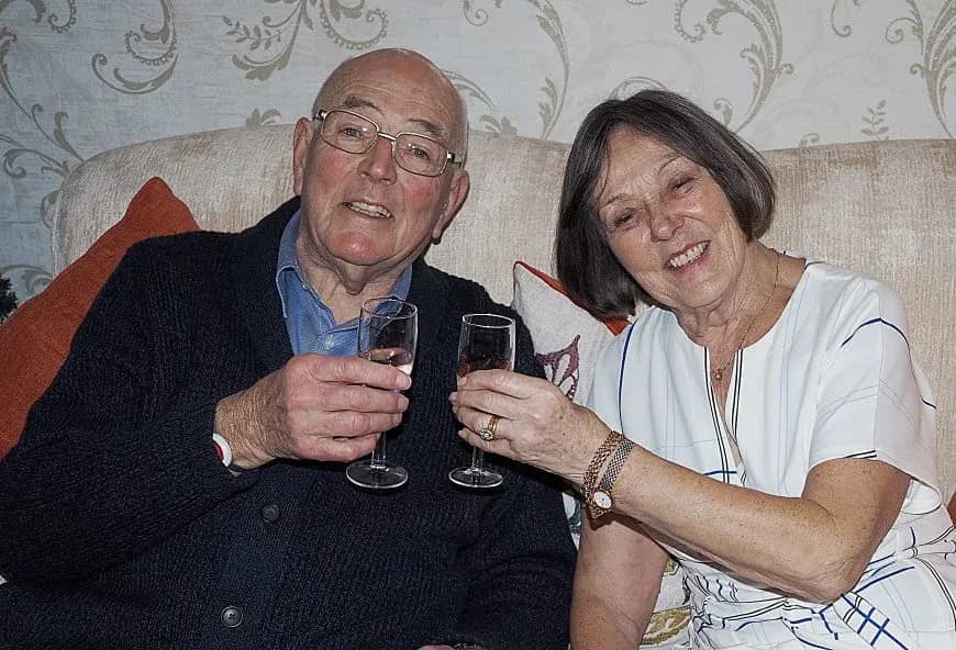 Residents celebrating New Year's Eve with a glass of fizz