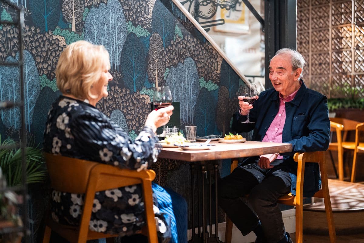 Residents enjoying a meal in a local restaurant