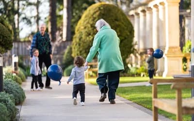 Residents with grandchildren in the grounds