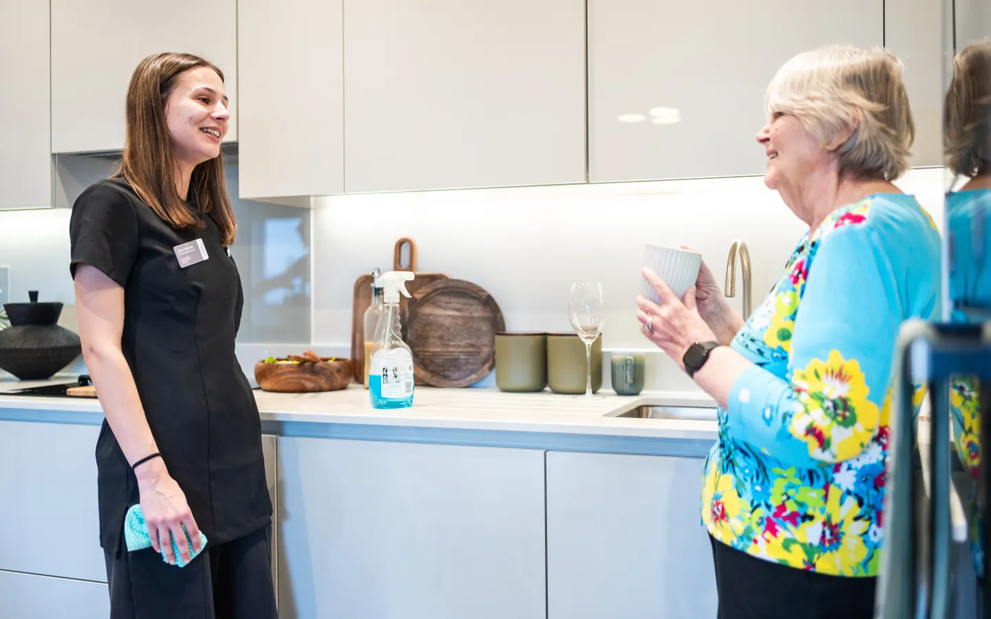 Staff cleaning a resident's kitchen