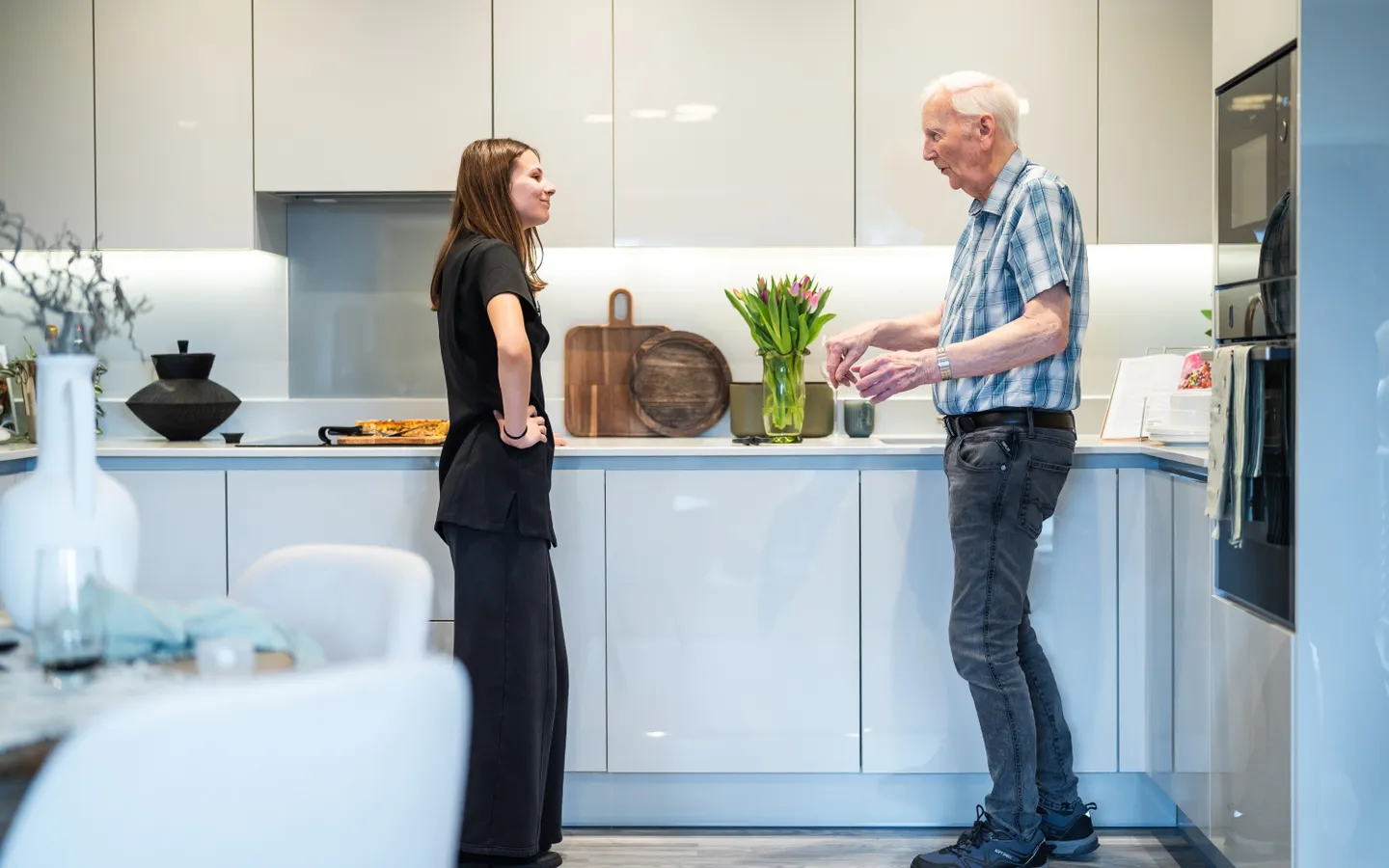 Staff in the kitchen with a resident
