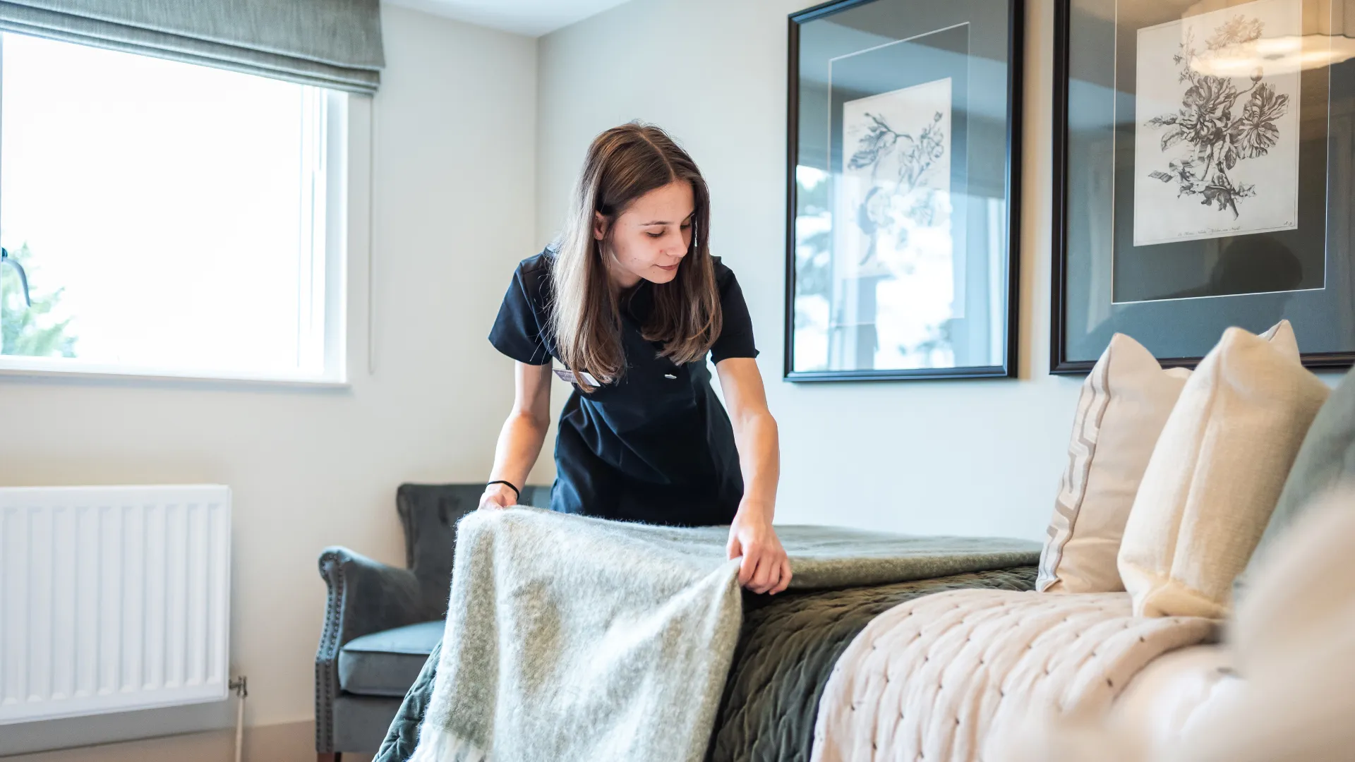 Staff making the bed