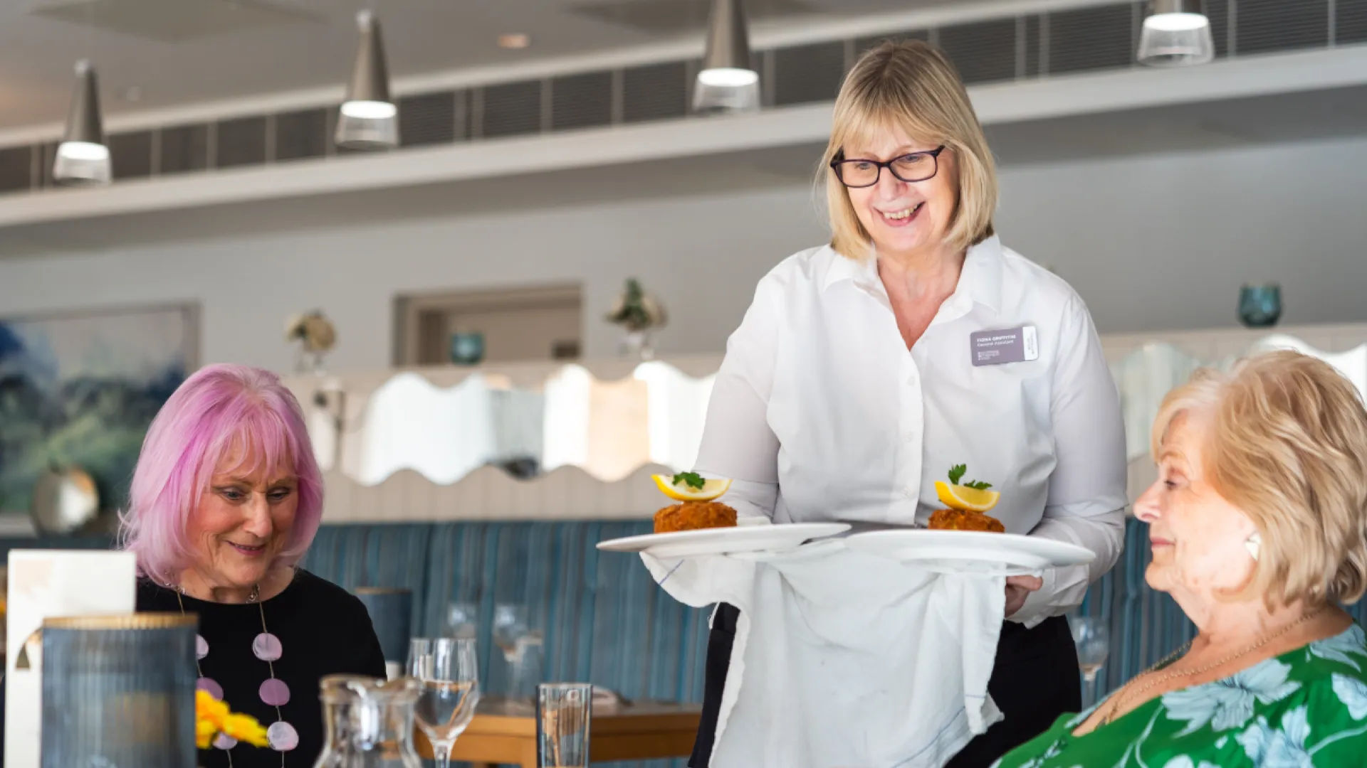 Staff serving meals in the restaurant