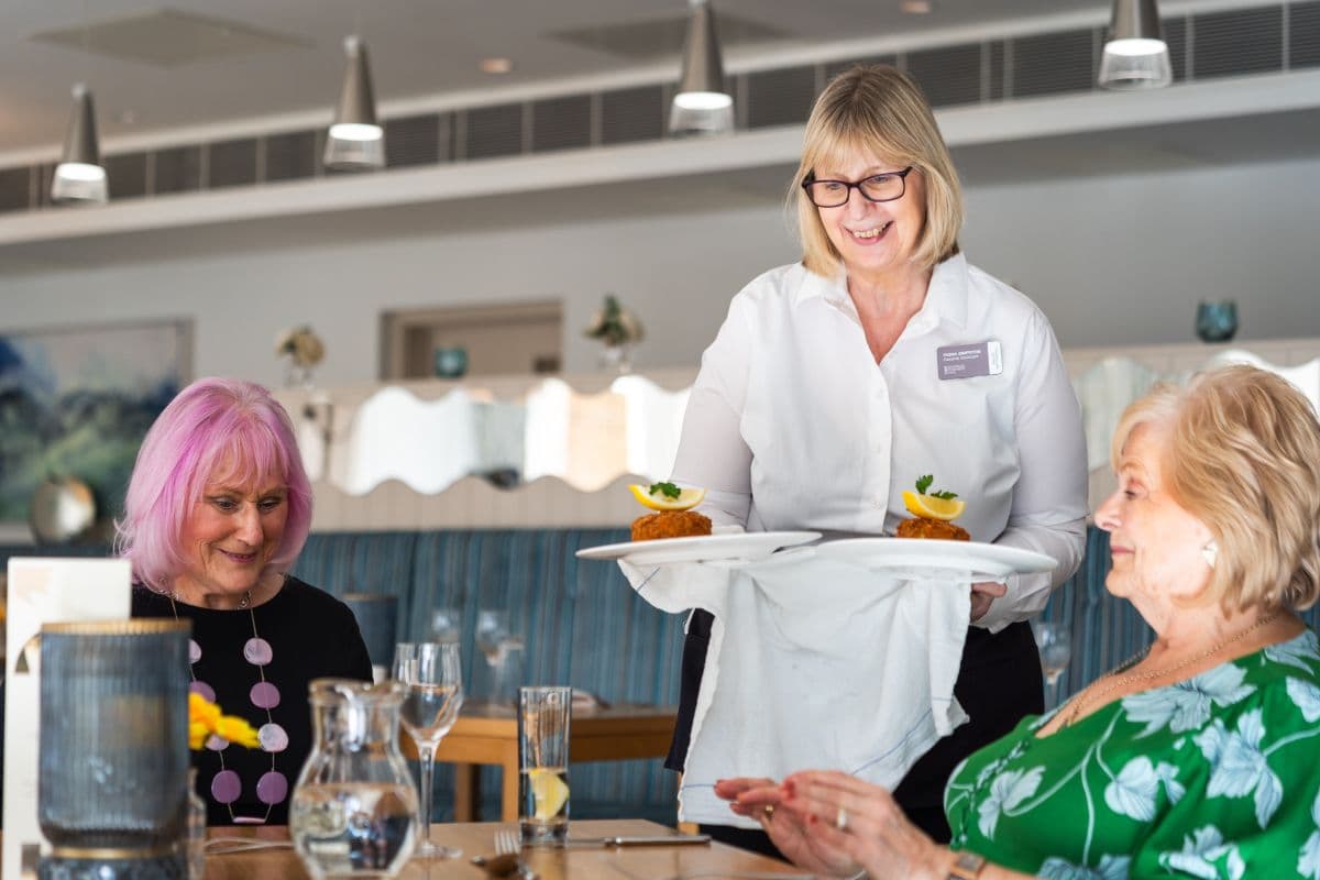 Staff serving meals in the restaurant