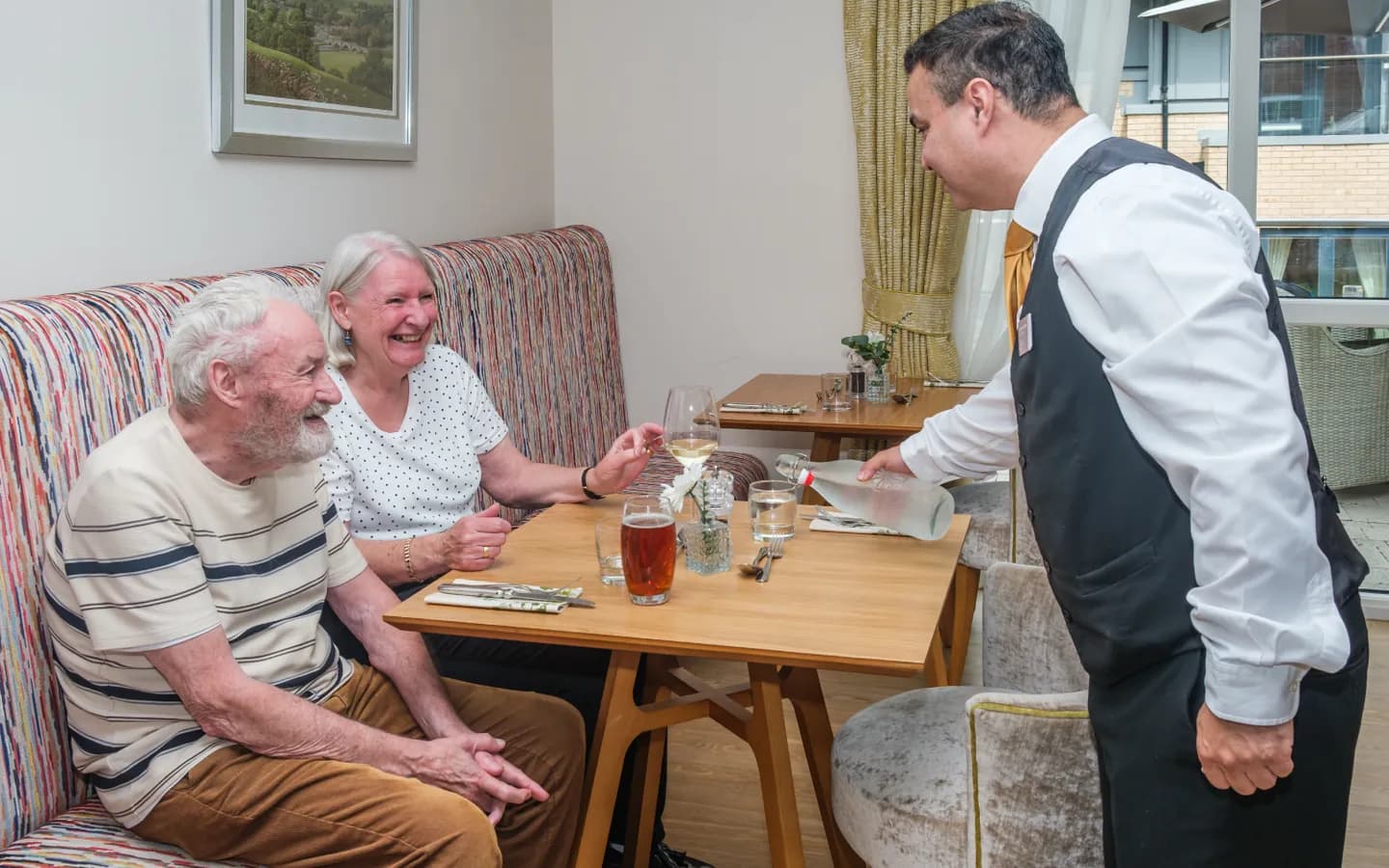 Staff serving residents in the restaurant