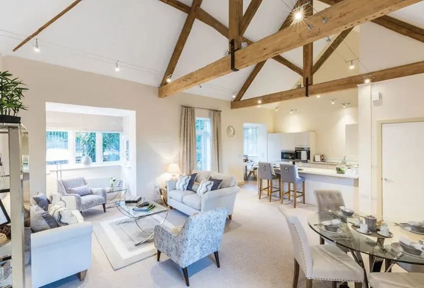 A show room with a kitchen and living room in it.