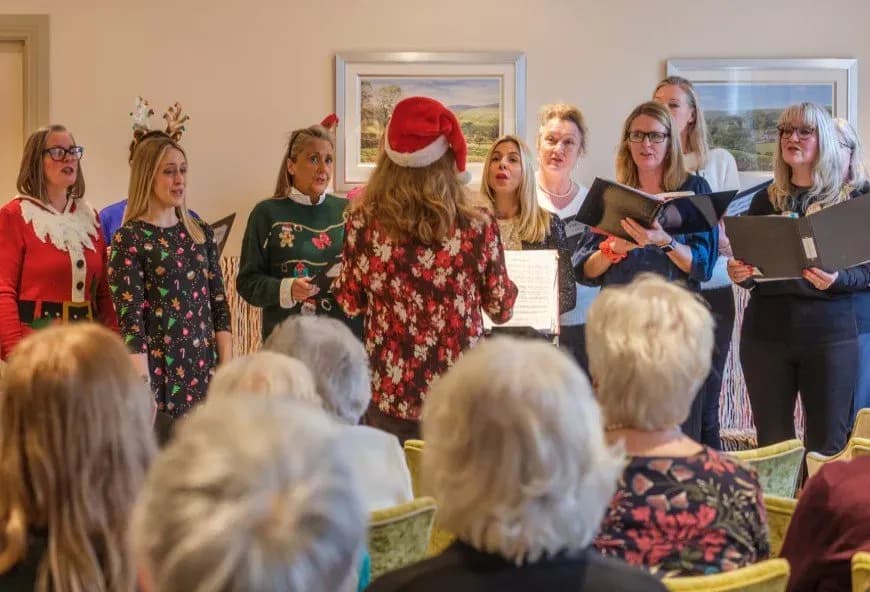 Choir singing at The Red House