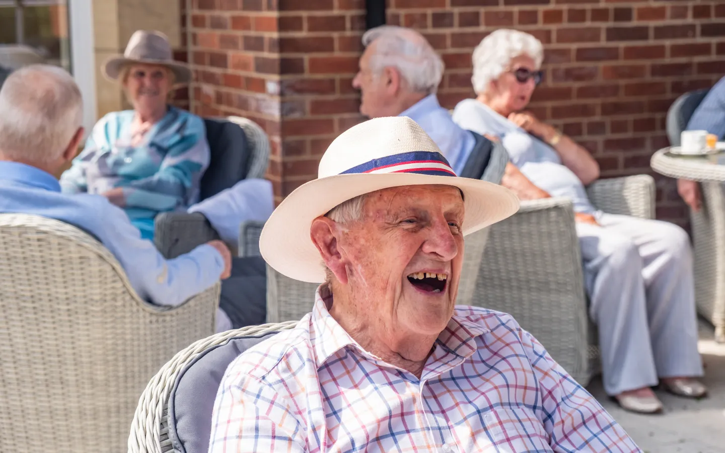 The Red House resident smiling outside
