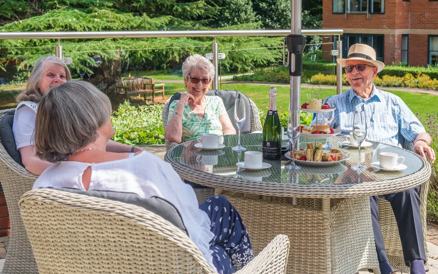 The Red House residents sat outside having afternoon tea