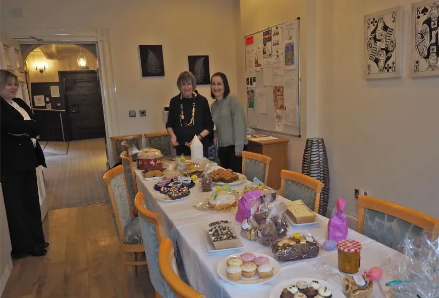 Bake sale table with Boughton Hall residents
