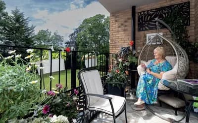Women sat outside with a book